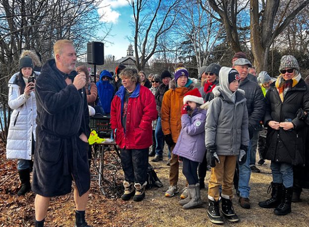 Dave Lavery welcomes participants and spectators to the 2024 Perth Polar Bear Plunge on Jan. 1.