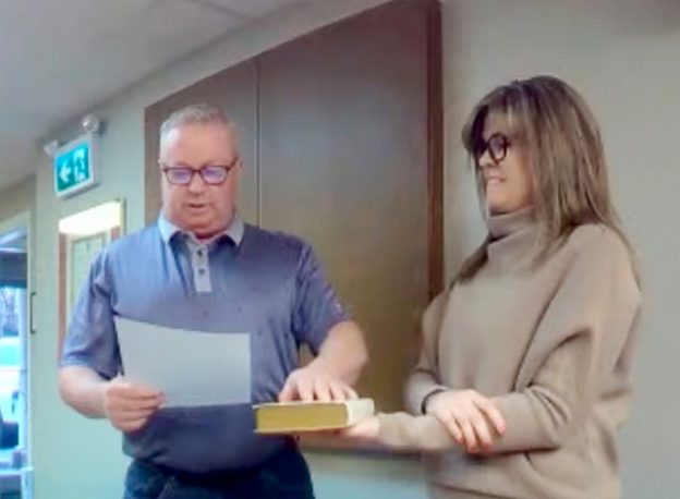 Trevor Johnson takes his oath and township clerk Allison Vereyken